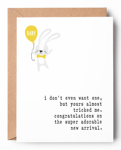 Funny letterpress new baby card, featuring a bunny holding a baby balloon. It says: I don't even want one, but yours almost tricked me. Congratulations on the super adorable new arrival.